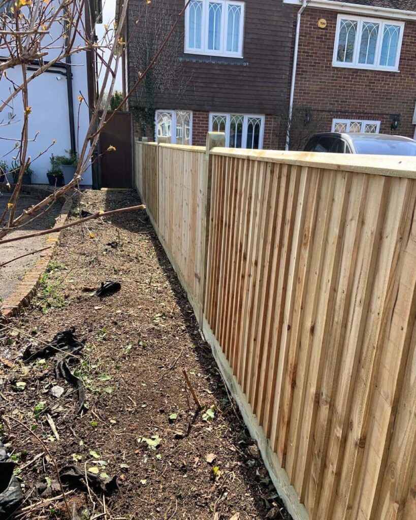 This is a photo of feather edge fencing installed in a residential property by Fast Fix Fencing Mundford