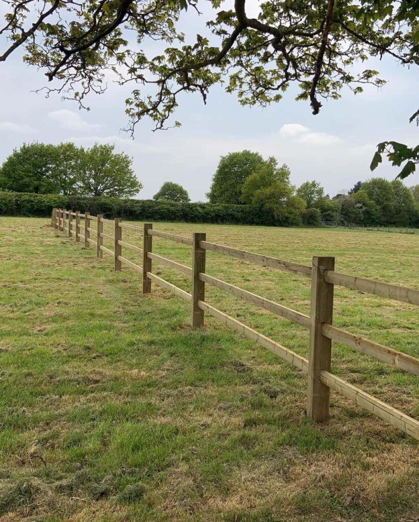 This is a photo of a post and rail fence installed in a field by Fast Fix Fencing Mundford
